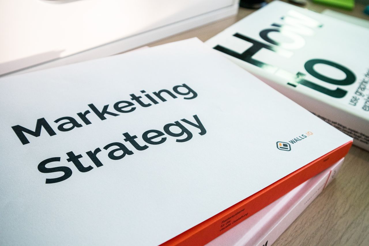 The Art of Drawing Readers In: Your attractive post title goes here A detailed view of marketing strategy documents with close focus on text, ideal for business and finance content.